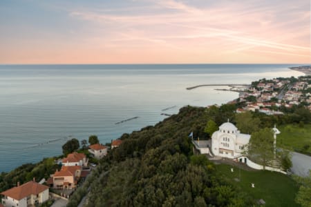 a town on a hill by the water