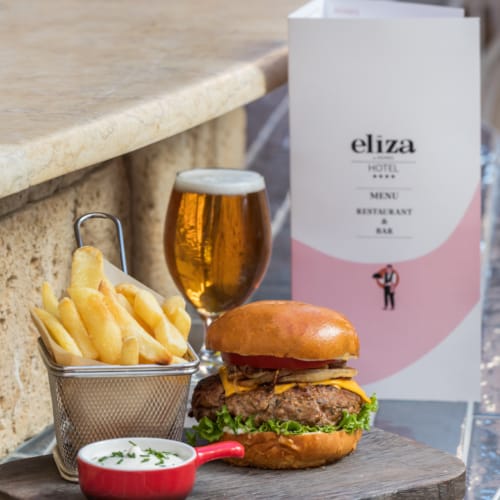 a table with a burger and fries