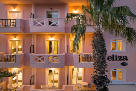 a building with palm trees