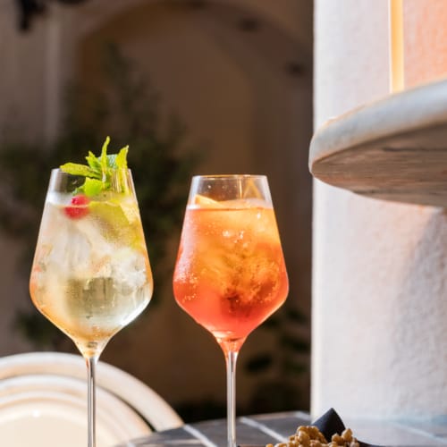 two glasses of wine on a table