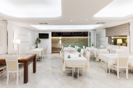 a room with tables and chairs