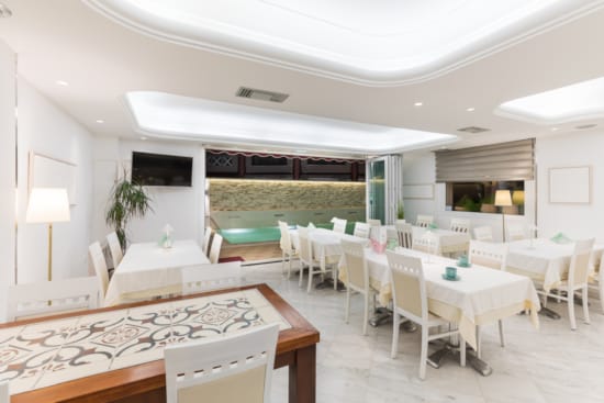 a room with tables and chairs