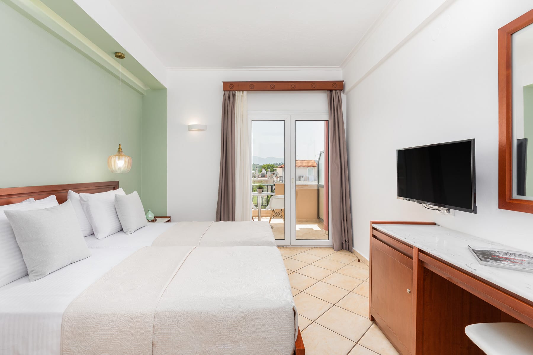 a bedroom with a tv and a bed