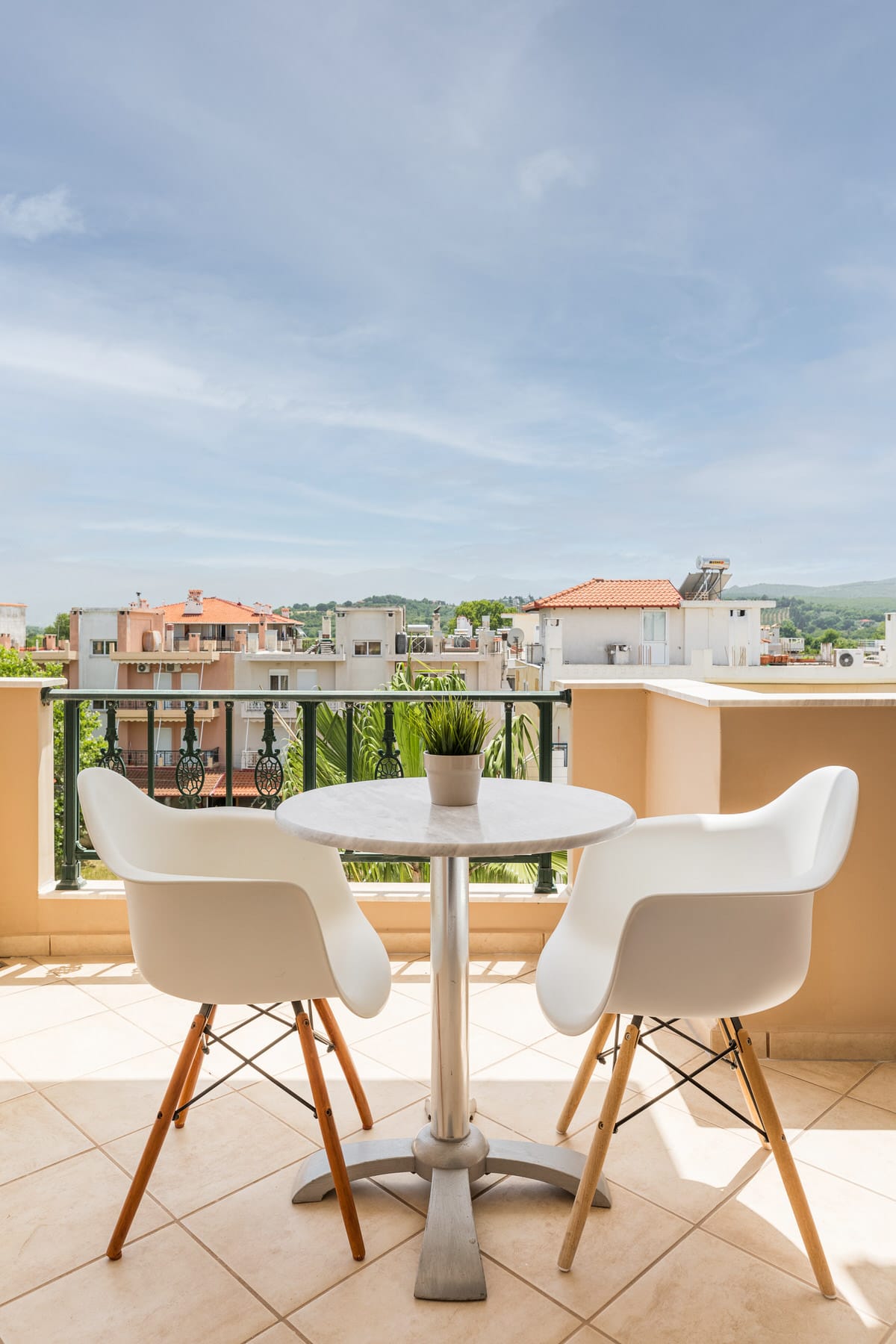 a table and chairs on a balcony