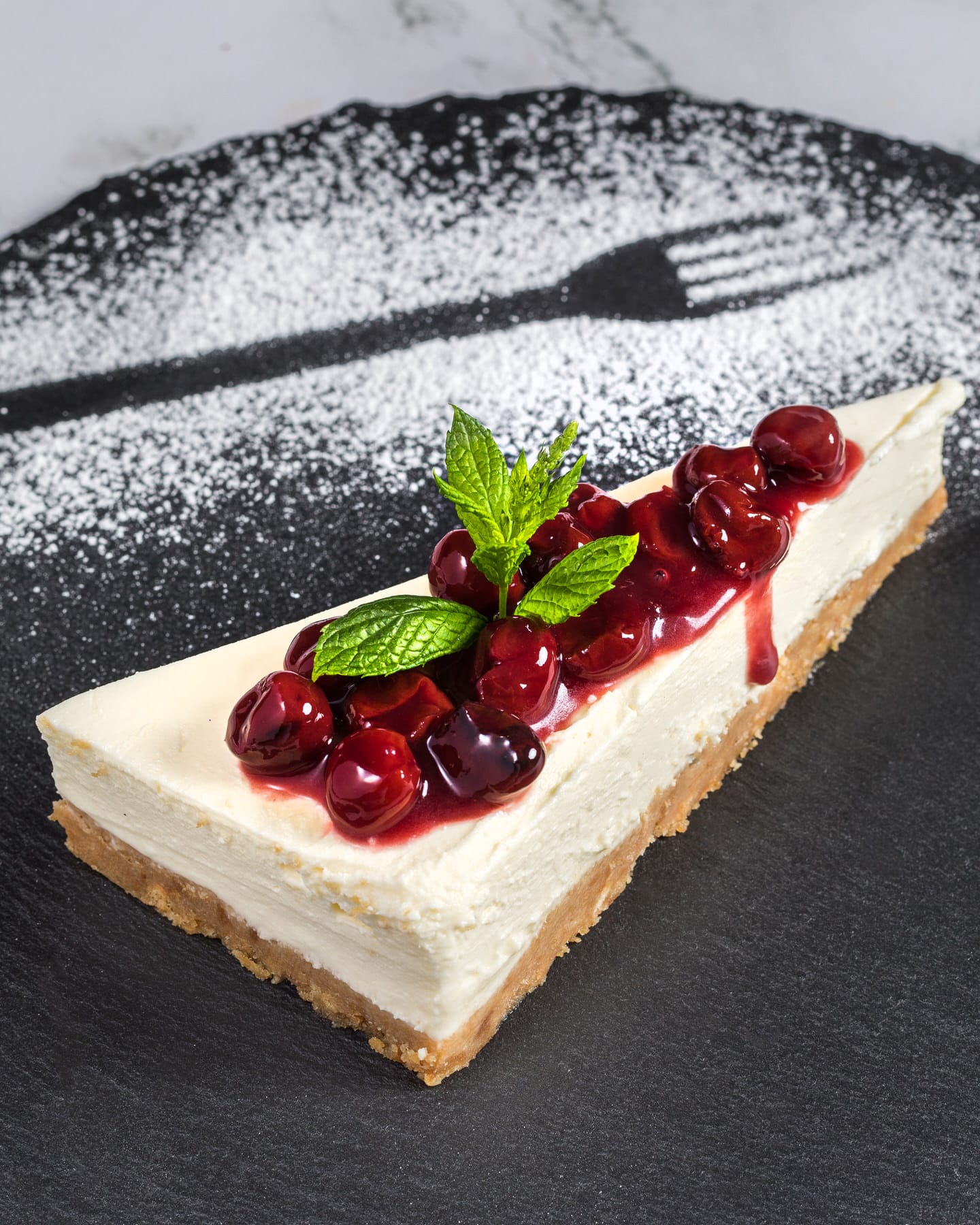 a piece of cake with fruit on top