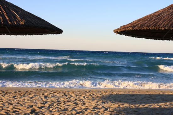 a beach with waves crashing