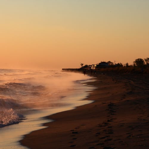 a beach with waves crashing on it