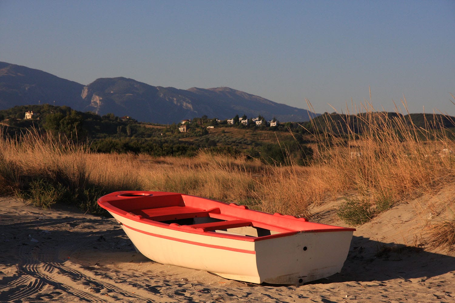 a boat on the sand