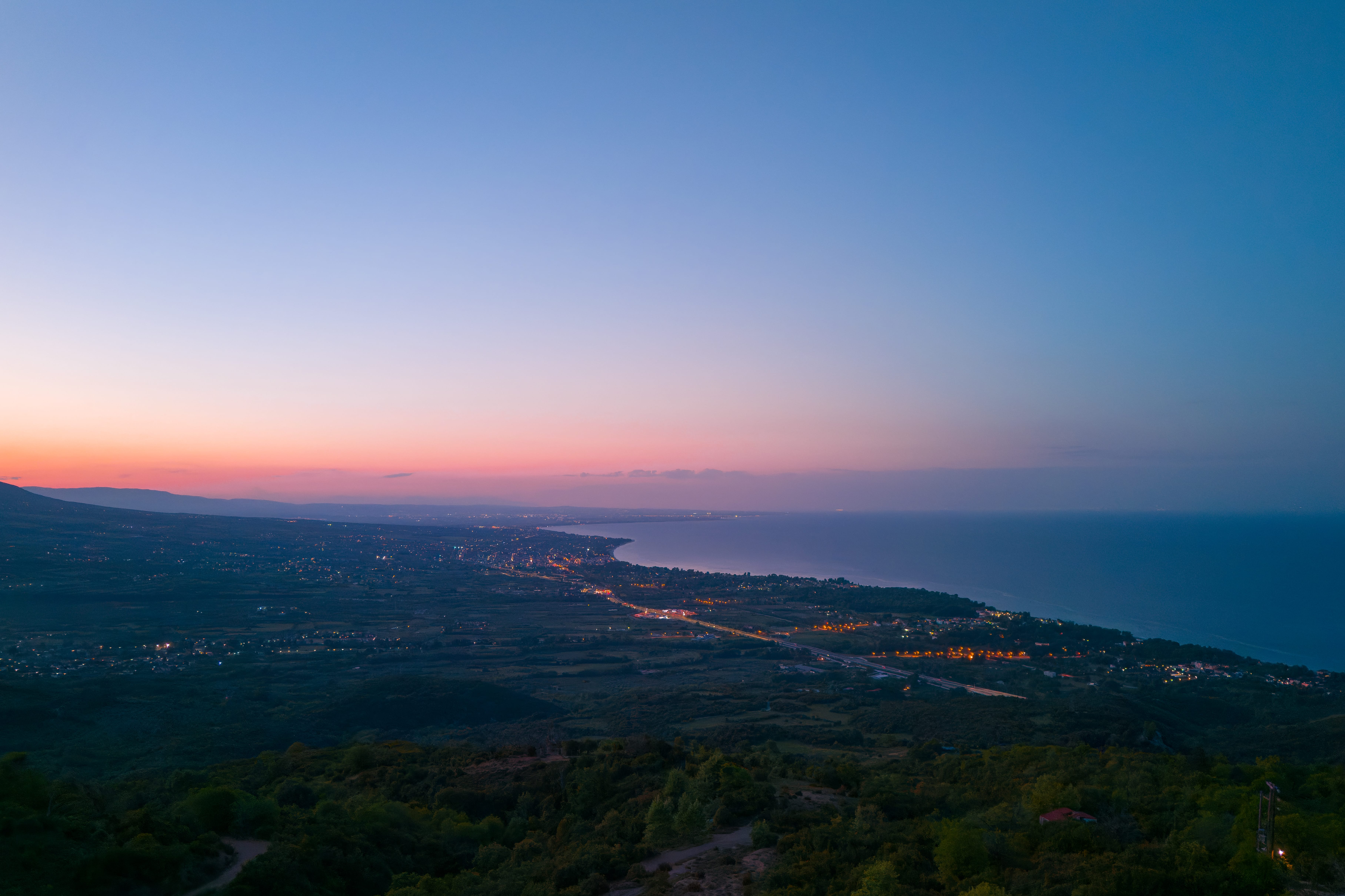 a landscape with trees and water
