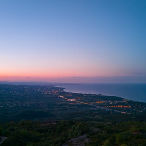 a landscape with trees and water