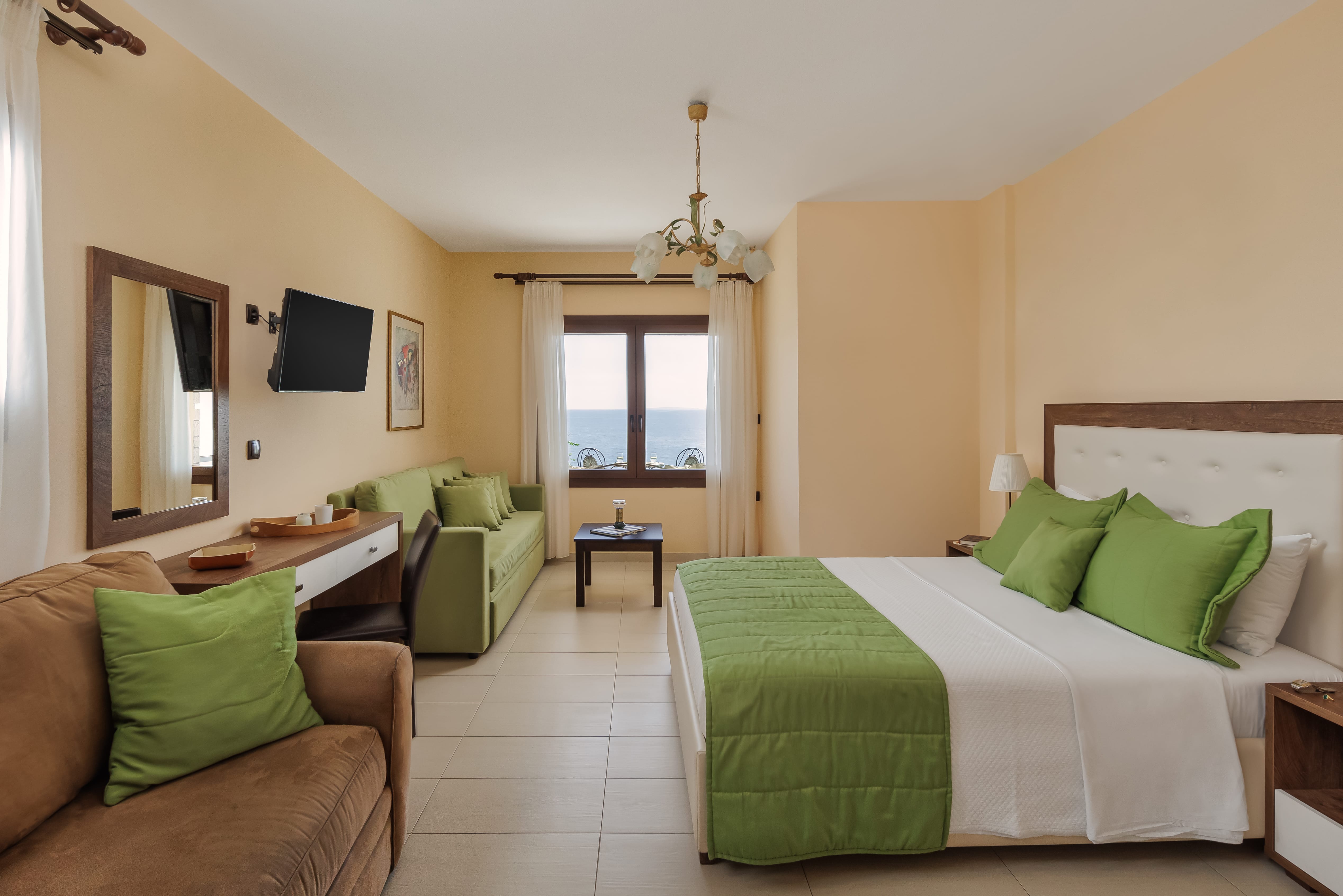 a bedroom with a bed and couches