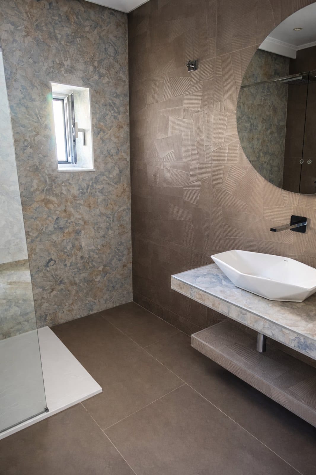 a bathroom with a marble countertop