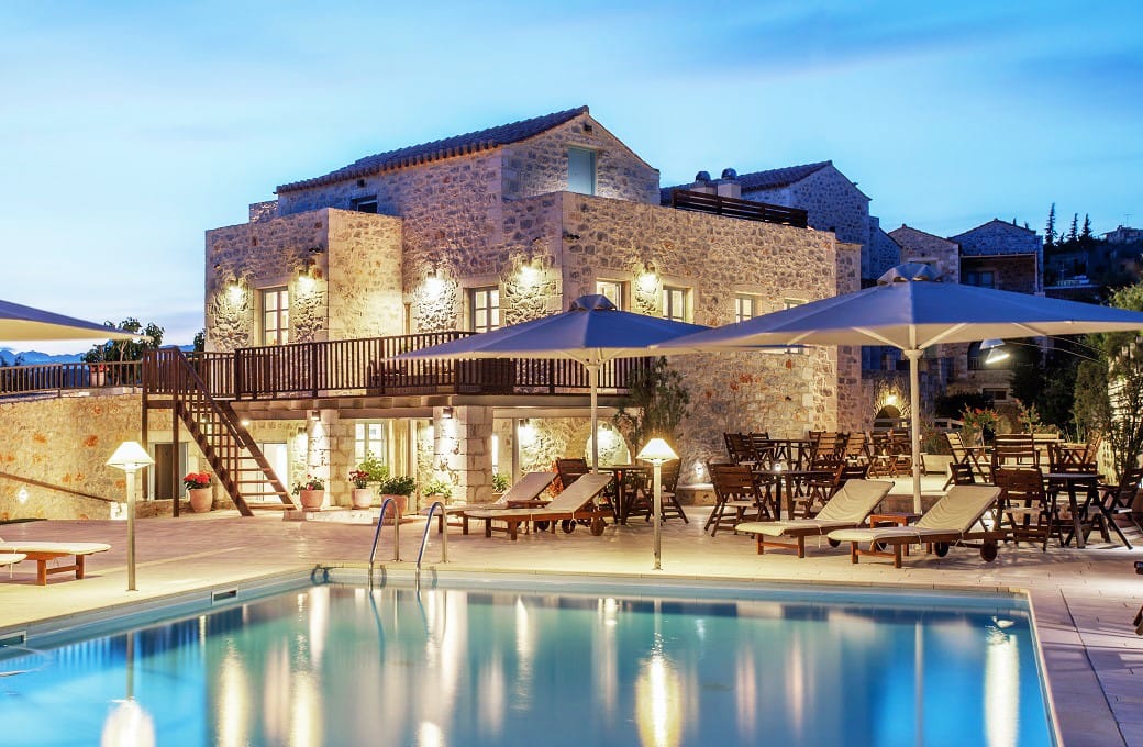 a pool in front of a house