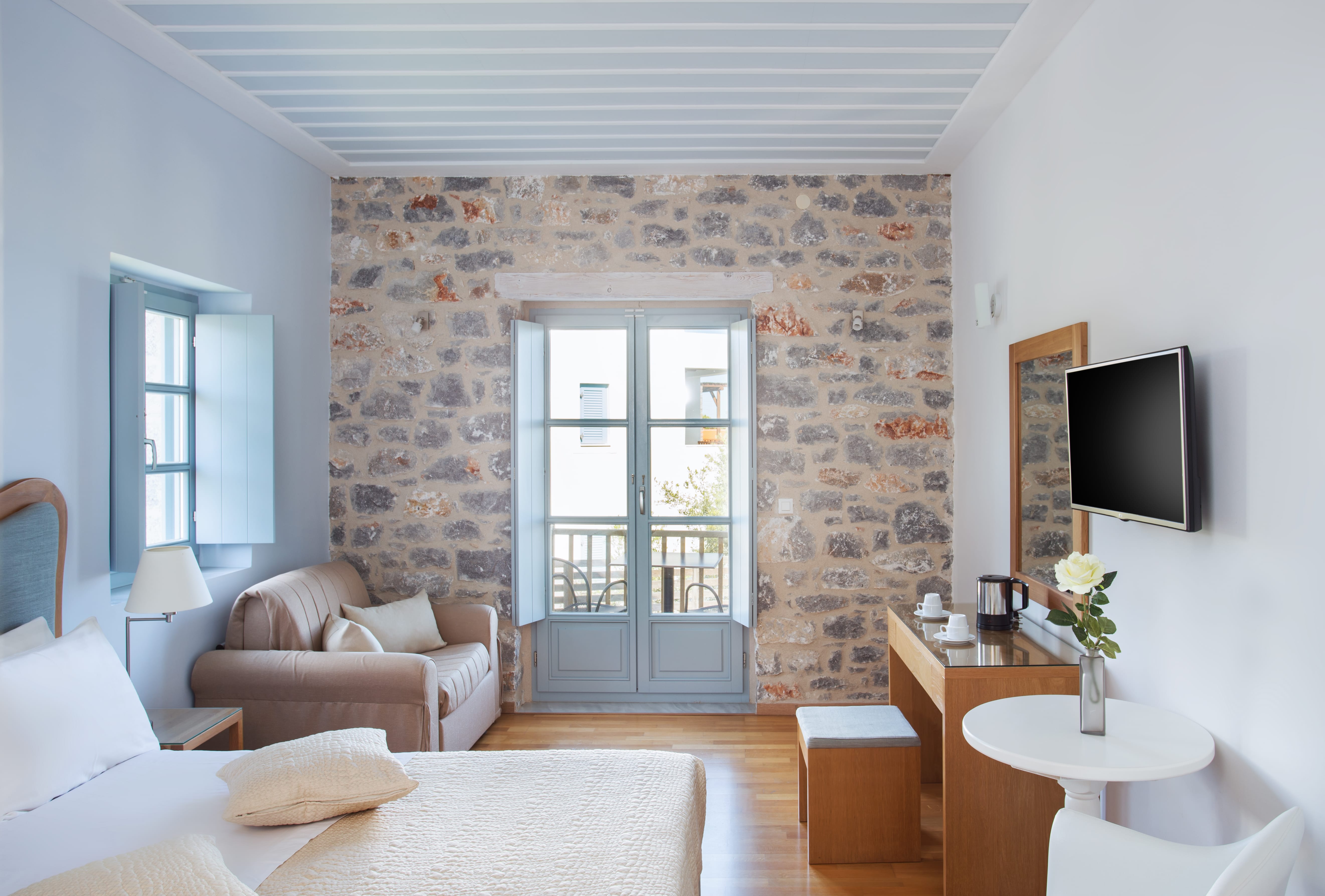 a living room with a tv and couches