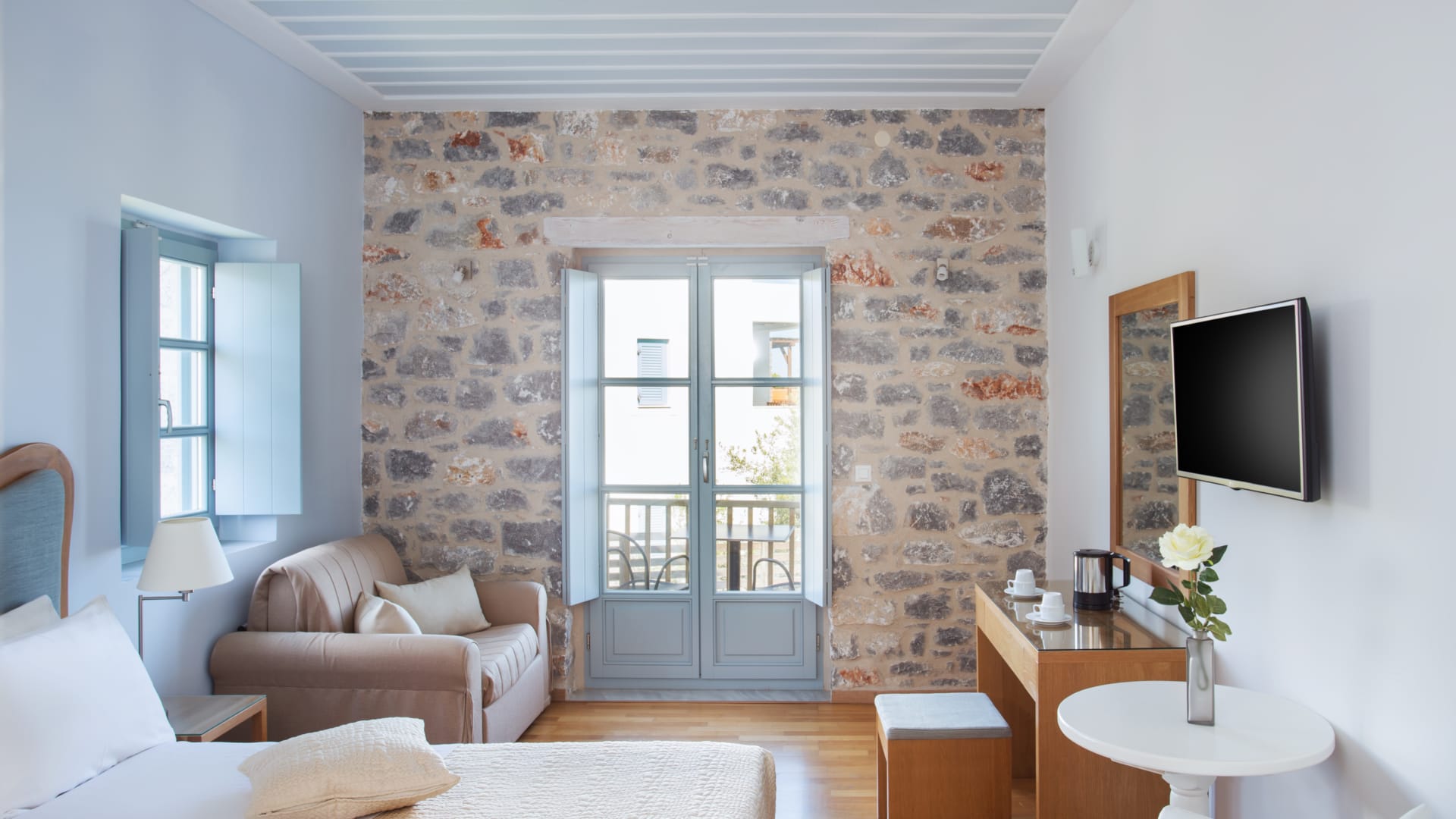 a living room with a tv and couches