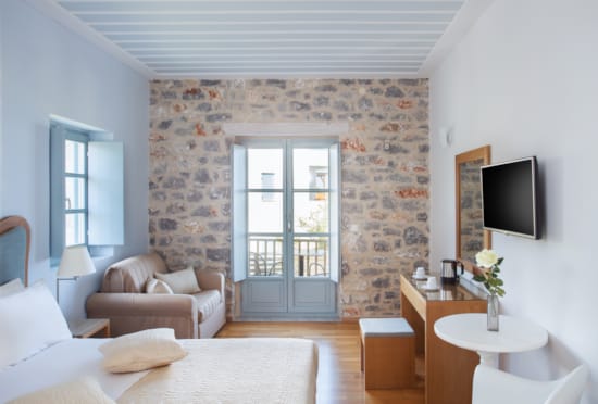 a living room with a tv and couches