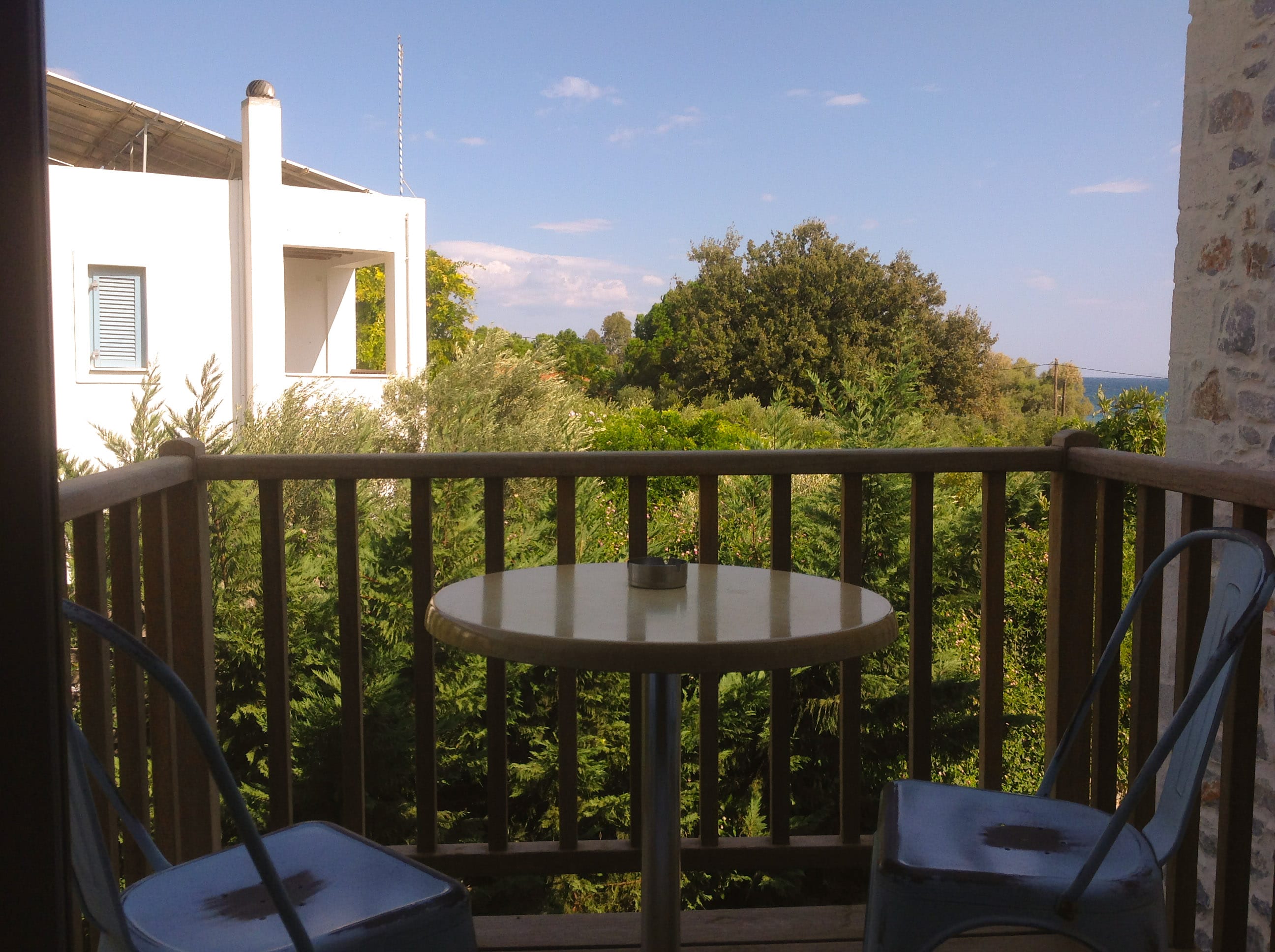 a table and chairs on a balcony
