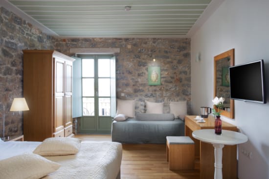 a living room with a couch and a tv