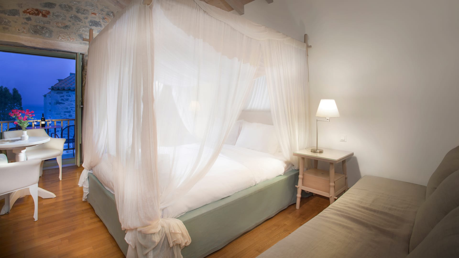 a bed with a white curtain