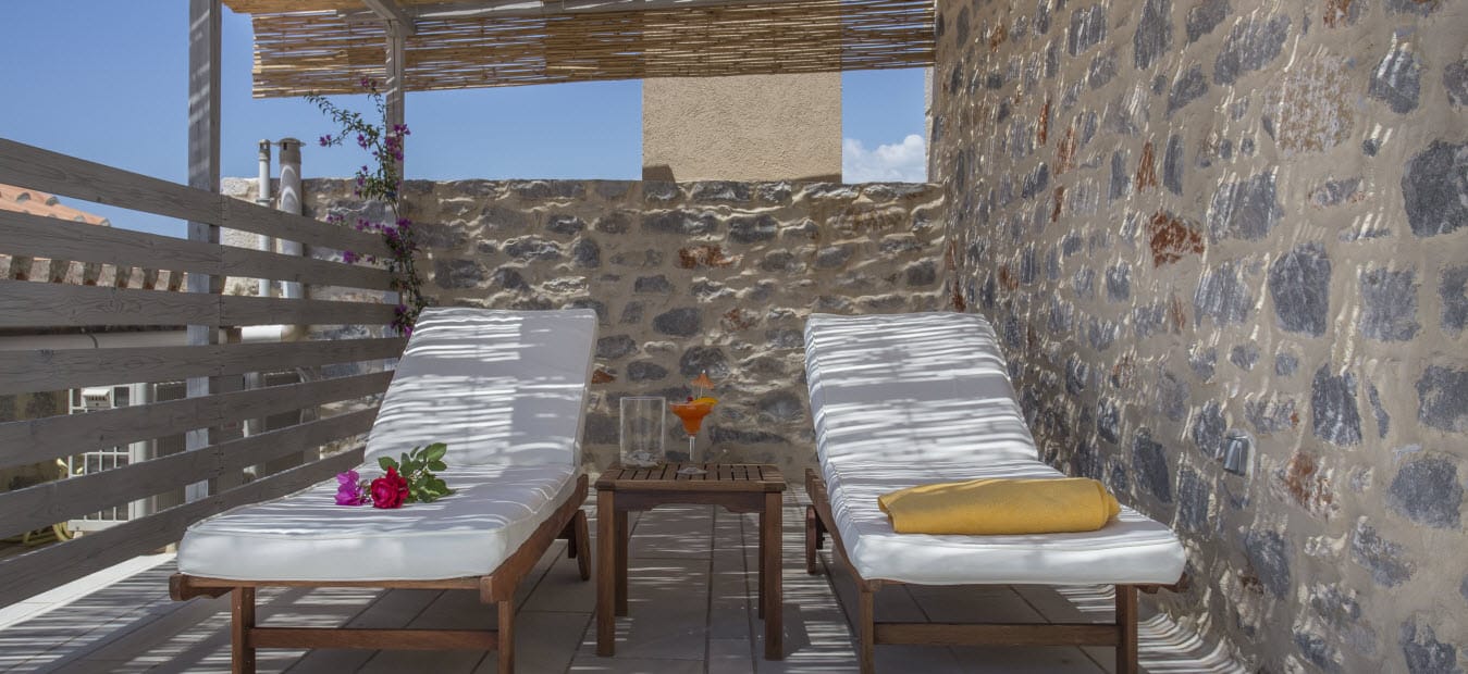 a patio with a table and chairs