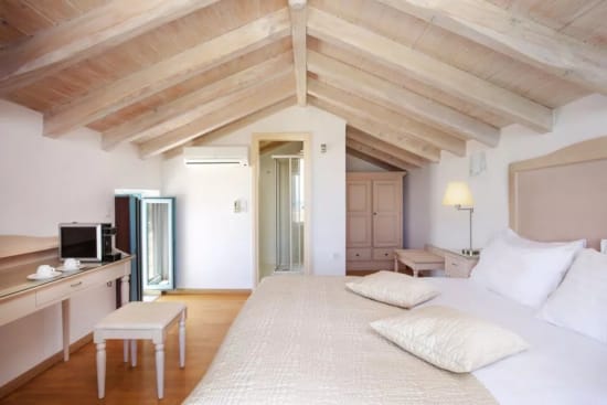 a room with a bed and a desk