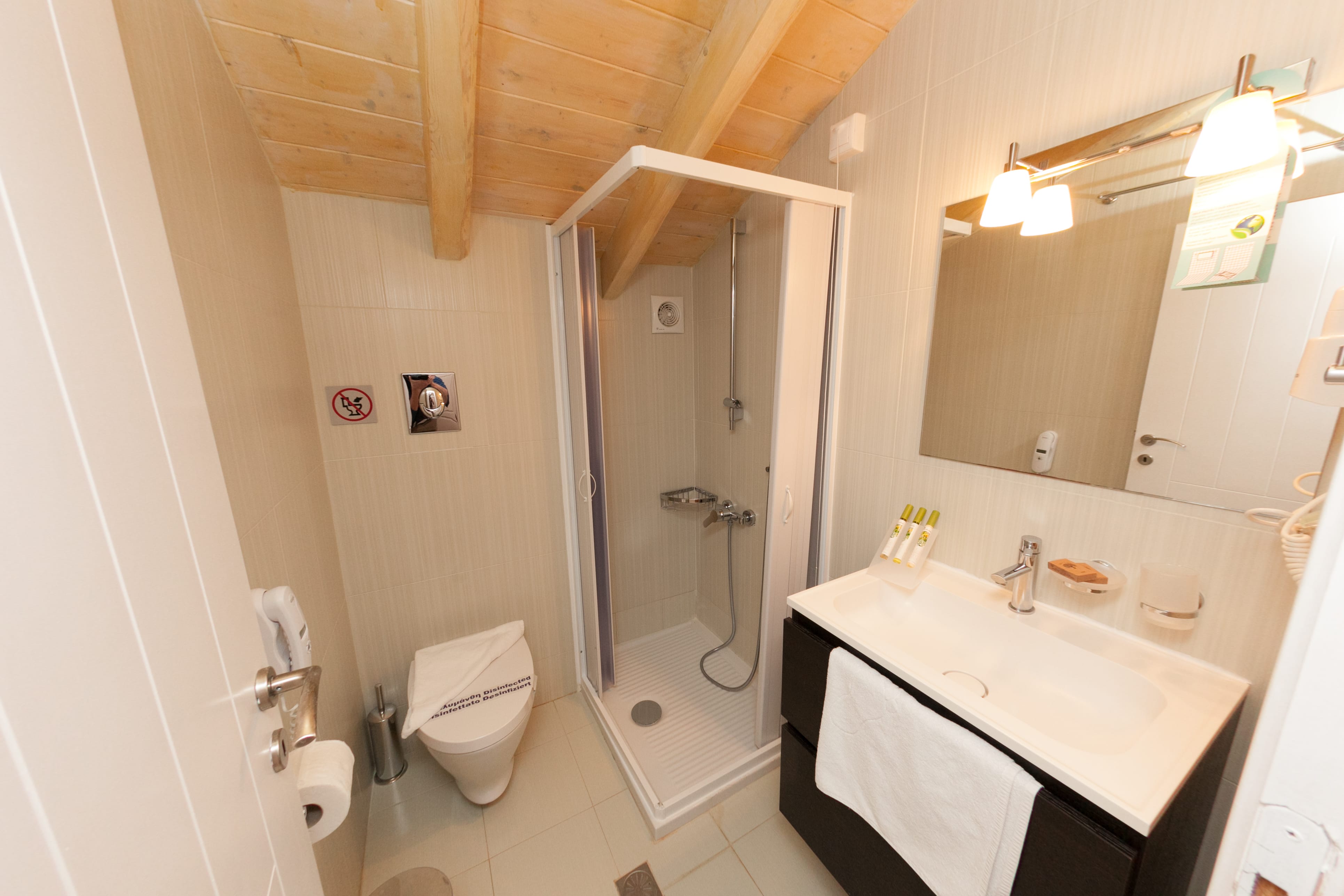 a bathroom with a shower and toilet