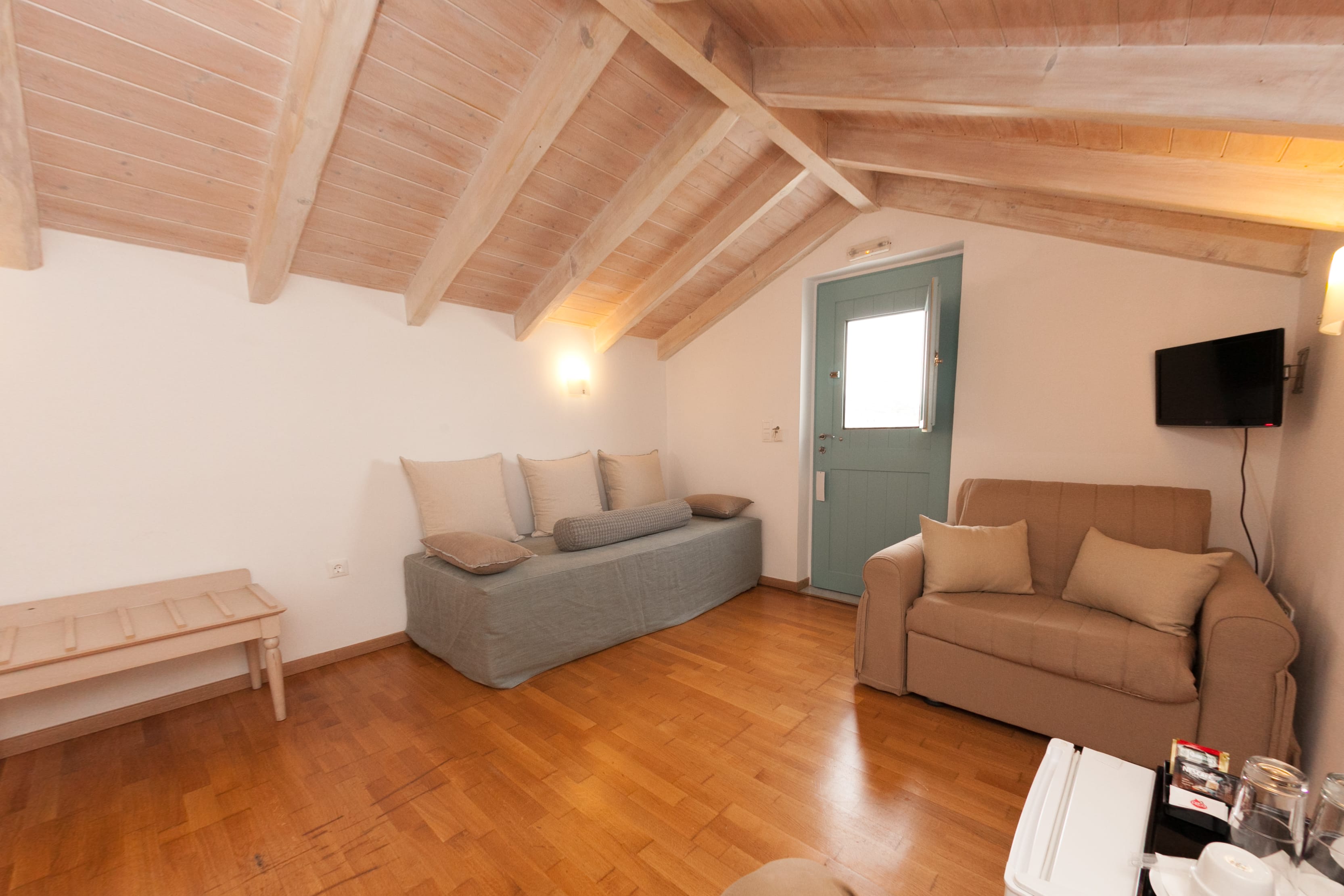 a living room with a couch and a tv