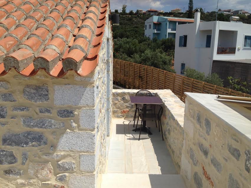 a patio with a table and chairs