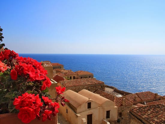 a group of buildings next to a body of water