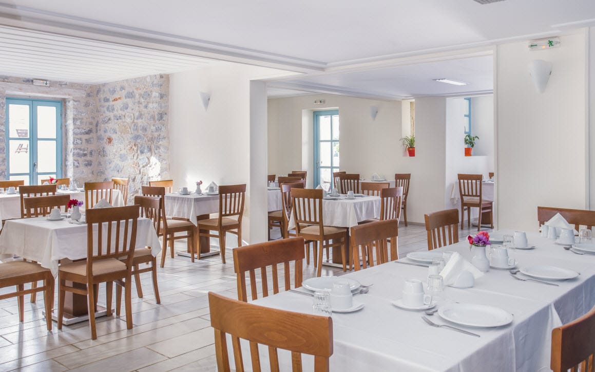 a room with tables and chairs