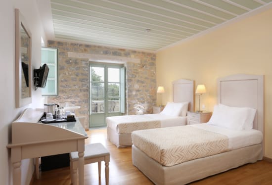 a room with a bed and a desk