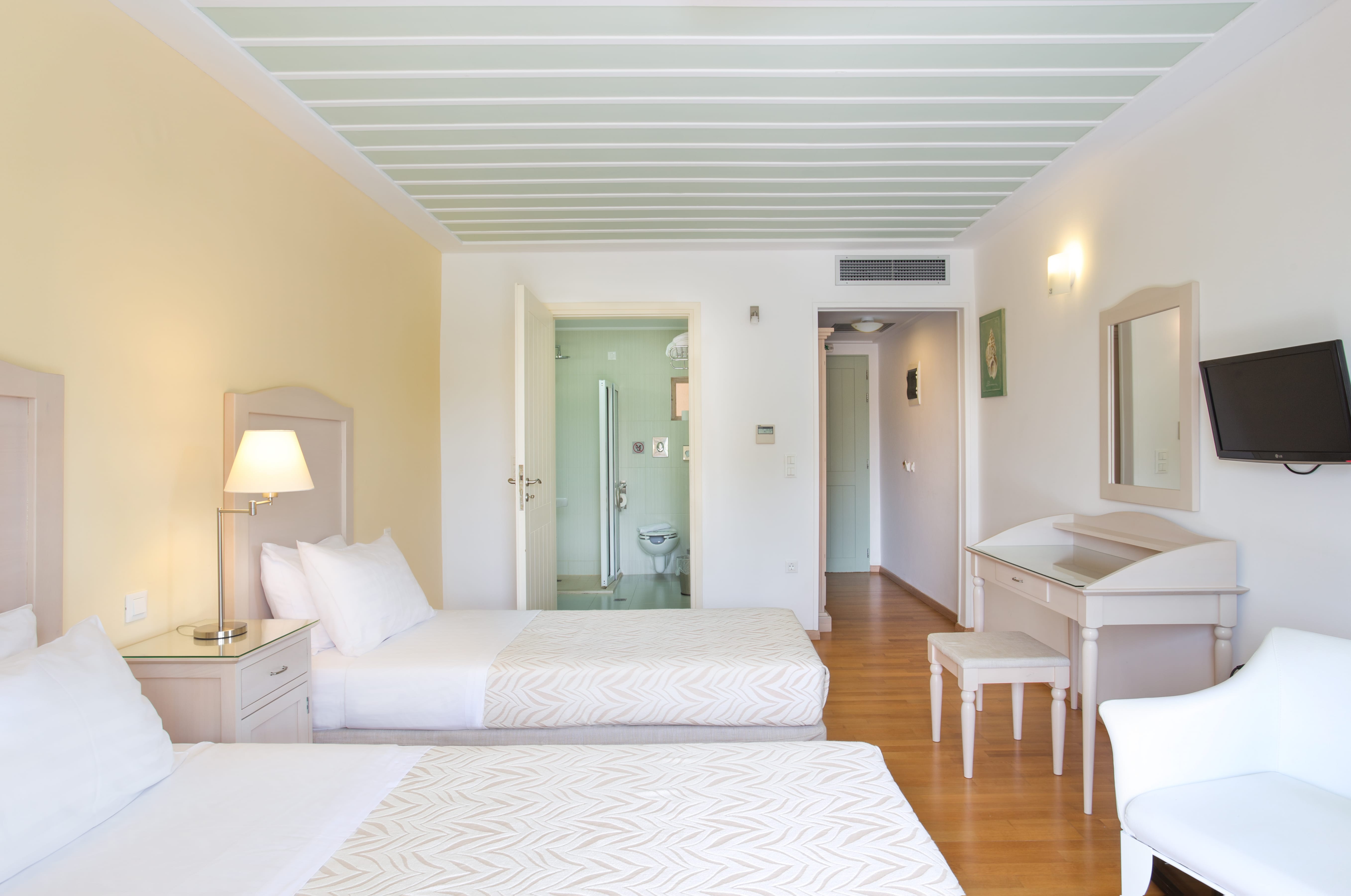 a room with a bed and a desk