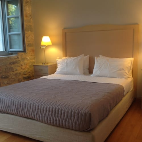 a bed with a white bed spread