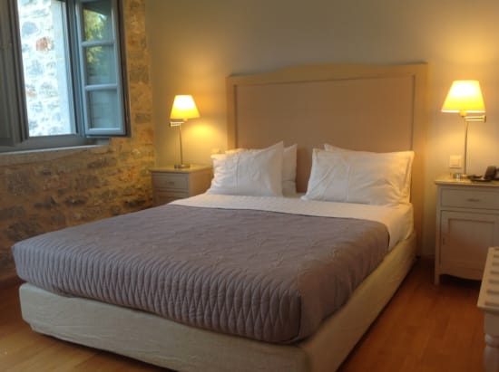 a bed with a white bed spread