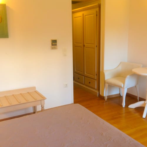 a room with a bench and a table