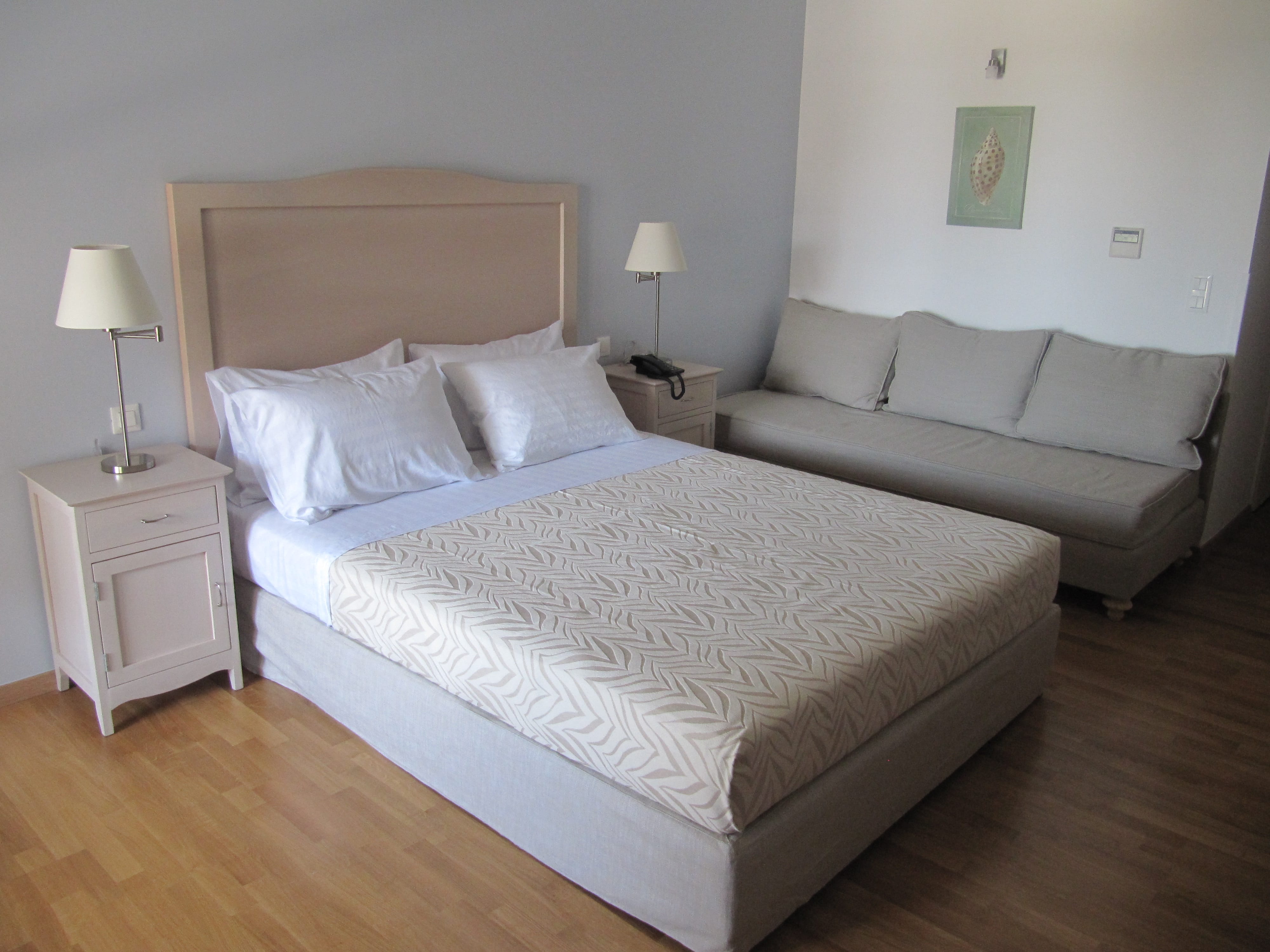 a bed with a white bed spread