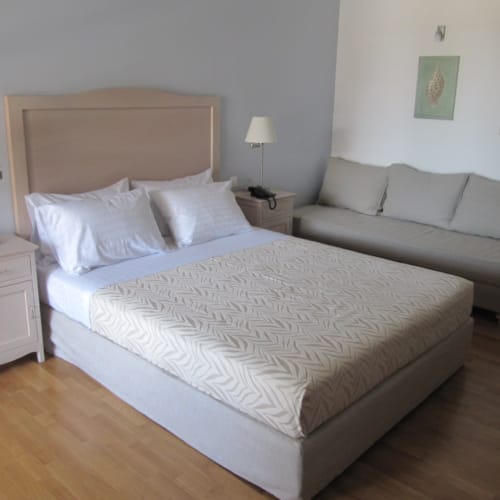 a bed with a white bed spread