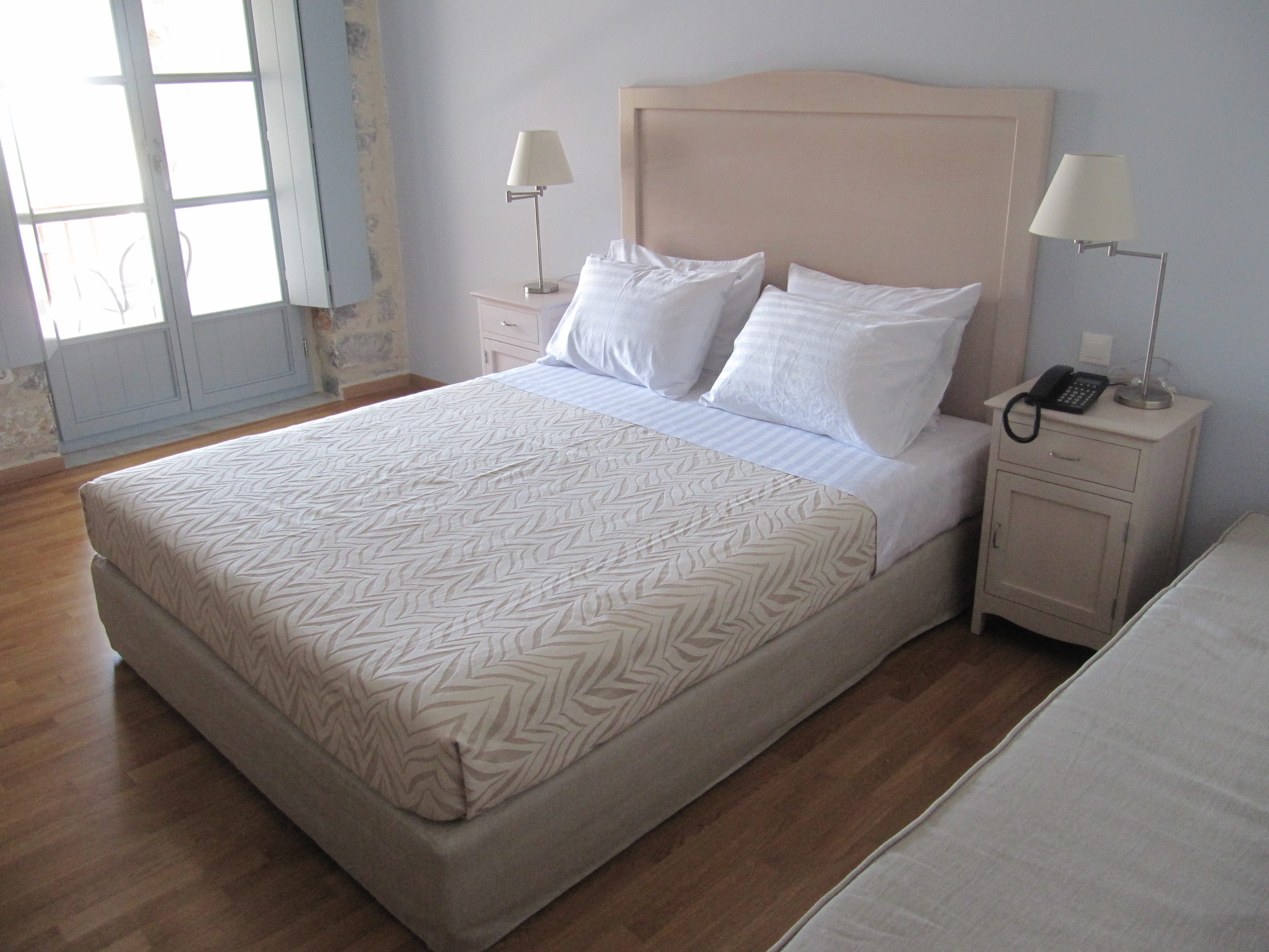 a bed with white sheets