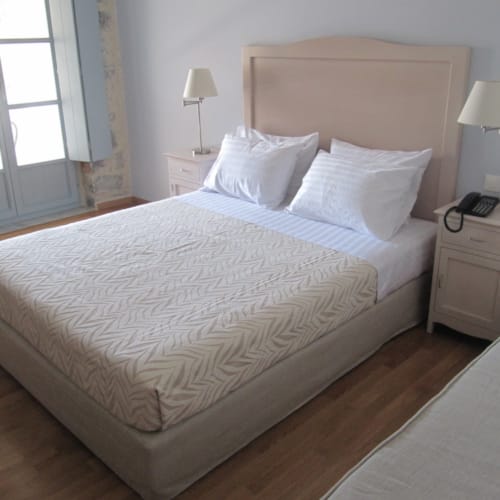 a bed with white sheets