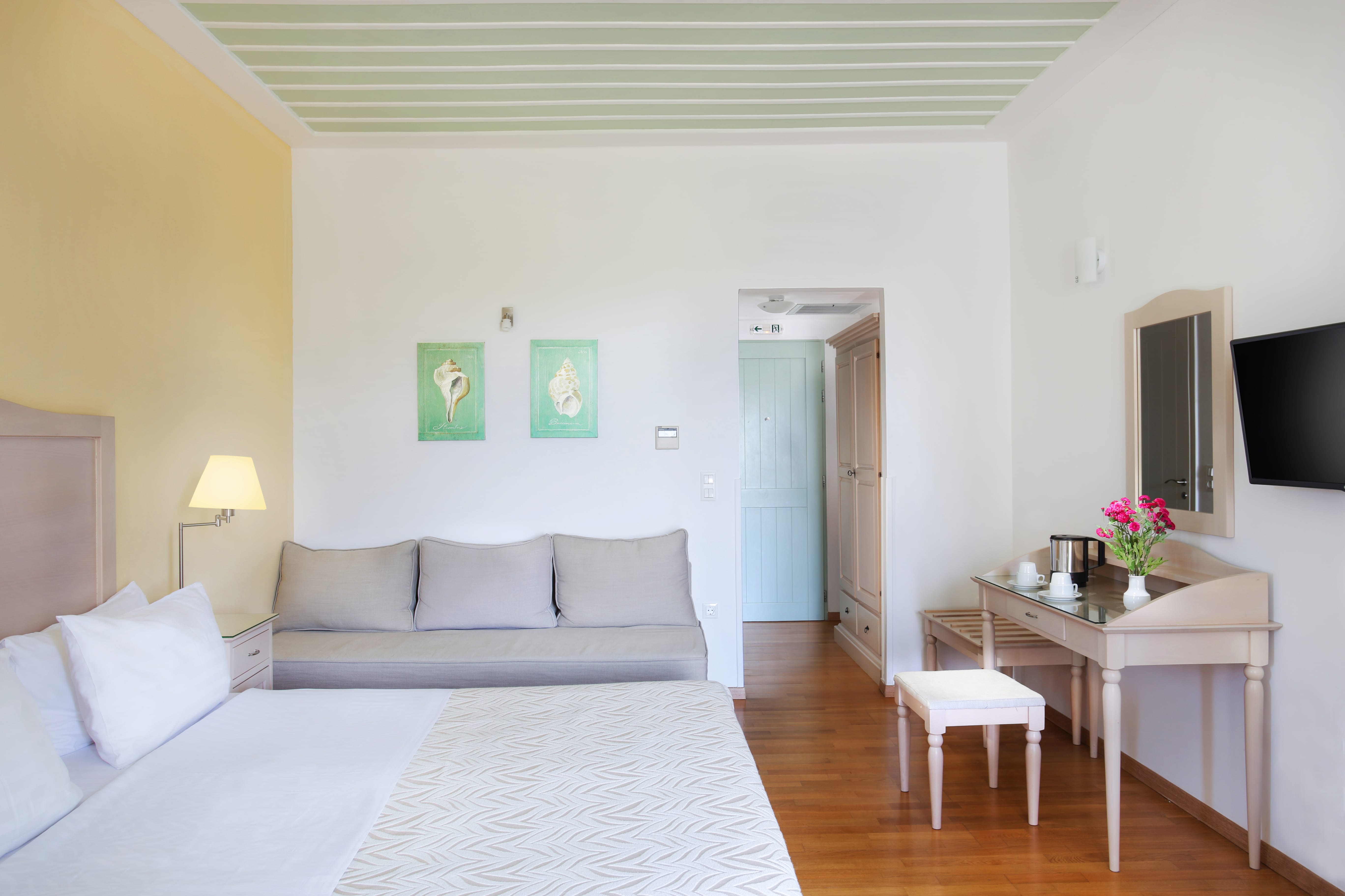 a living room with a white couch and a table