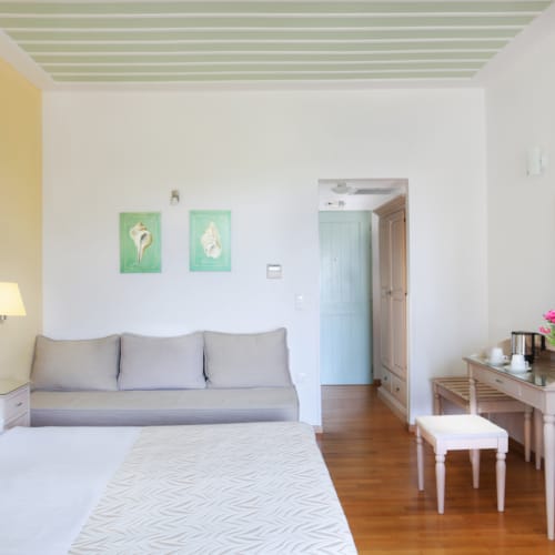 a living room with a white couch and a table