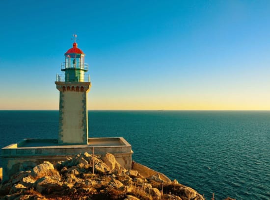 a lighthouse on a rocky island