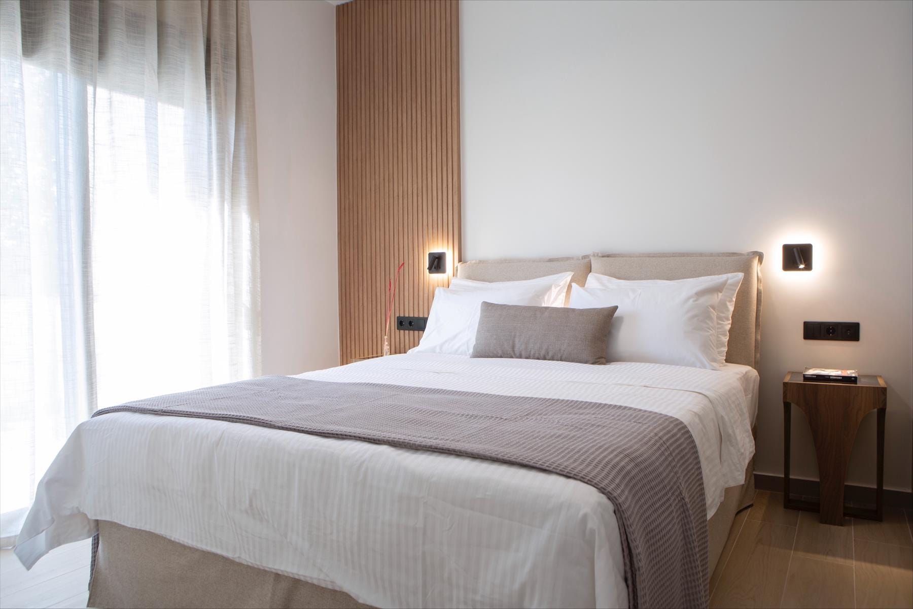 a bed with white sheets