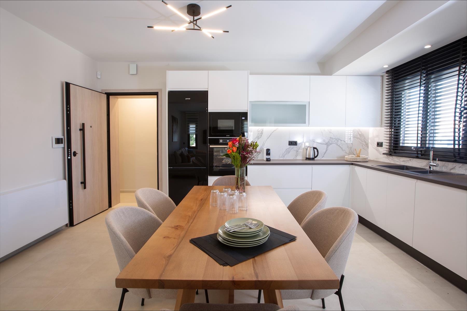 a kitchen with a dining table