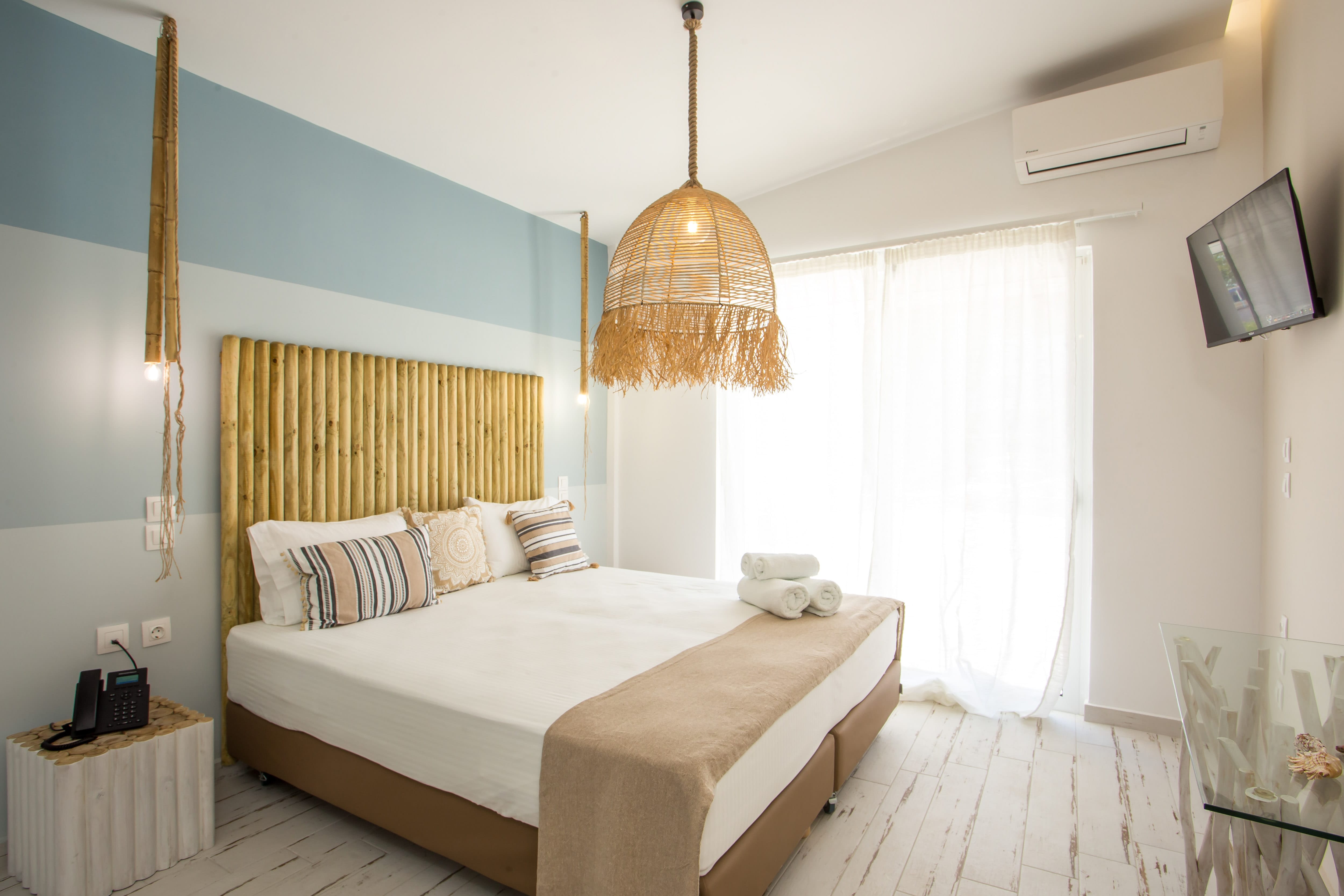 a bed with a lamp on the side