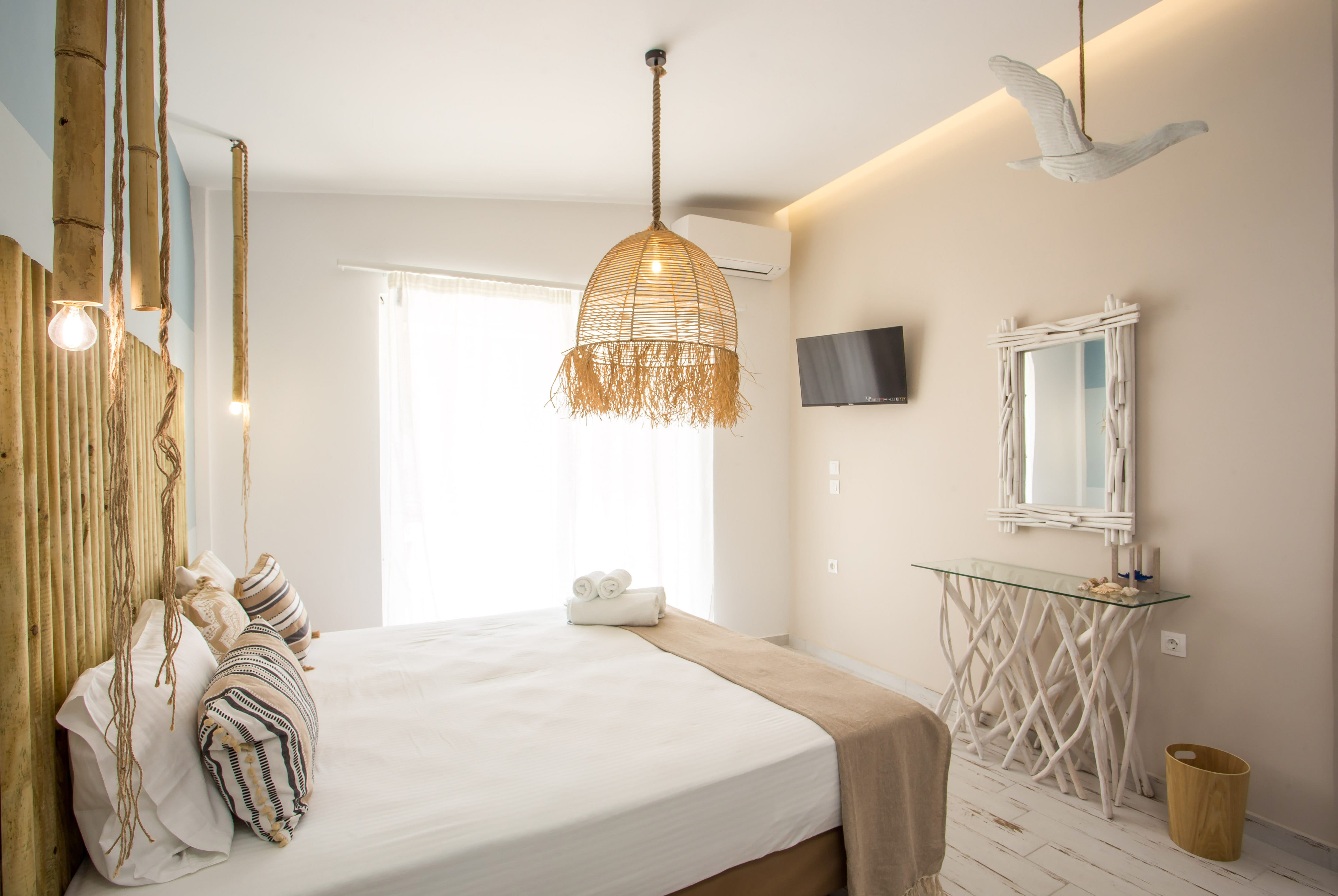 a bedroom with a bed and a lamp