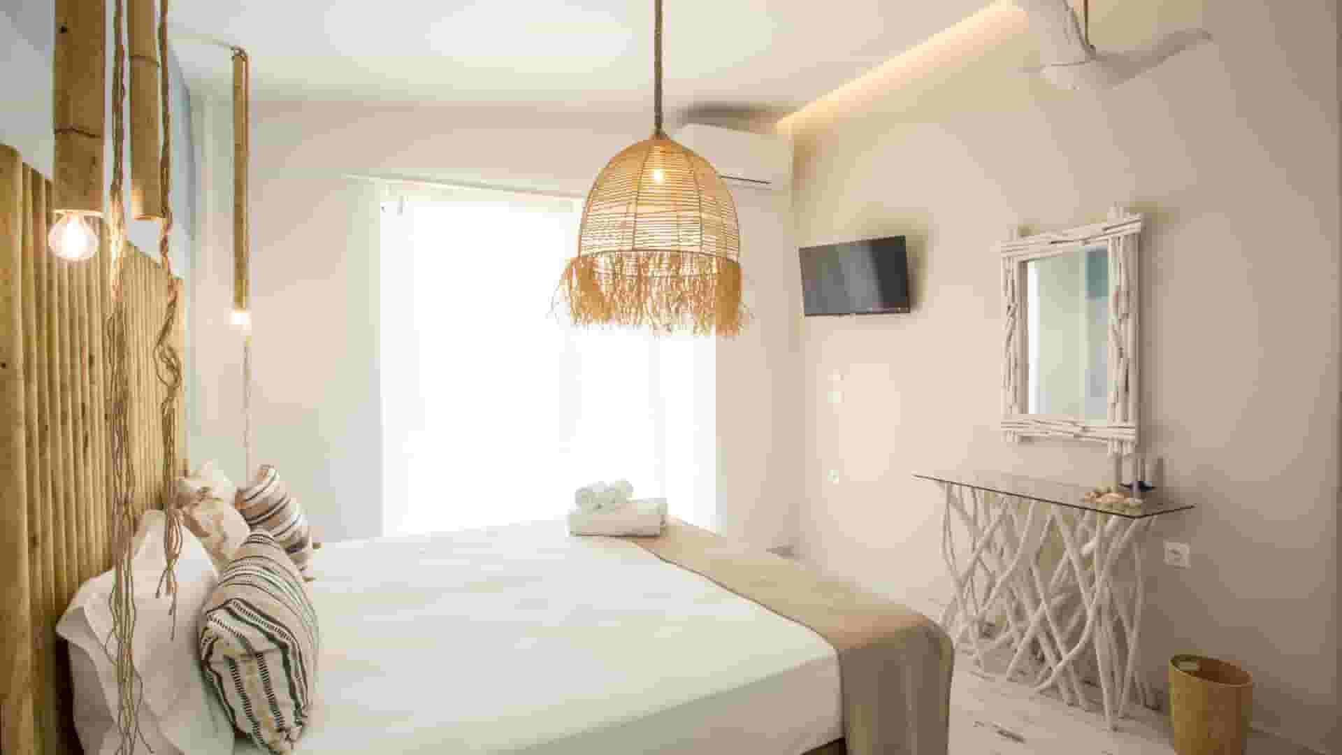a bedroom with a bed and a lamp