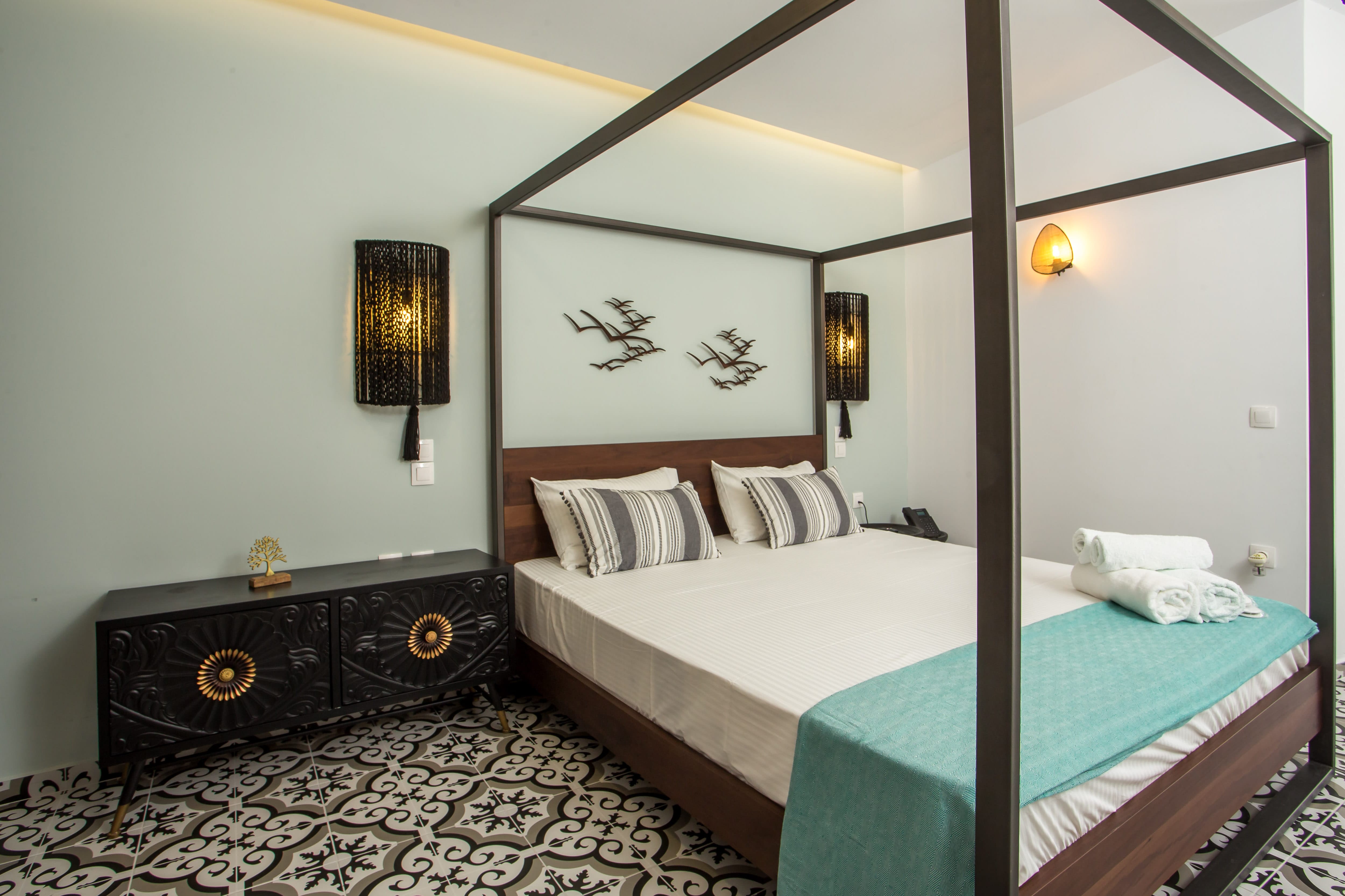 a bedroom with a bed and a mirror