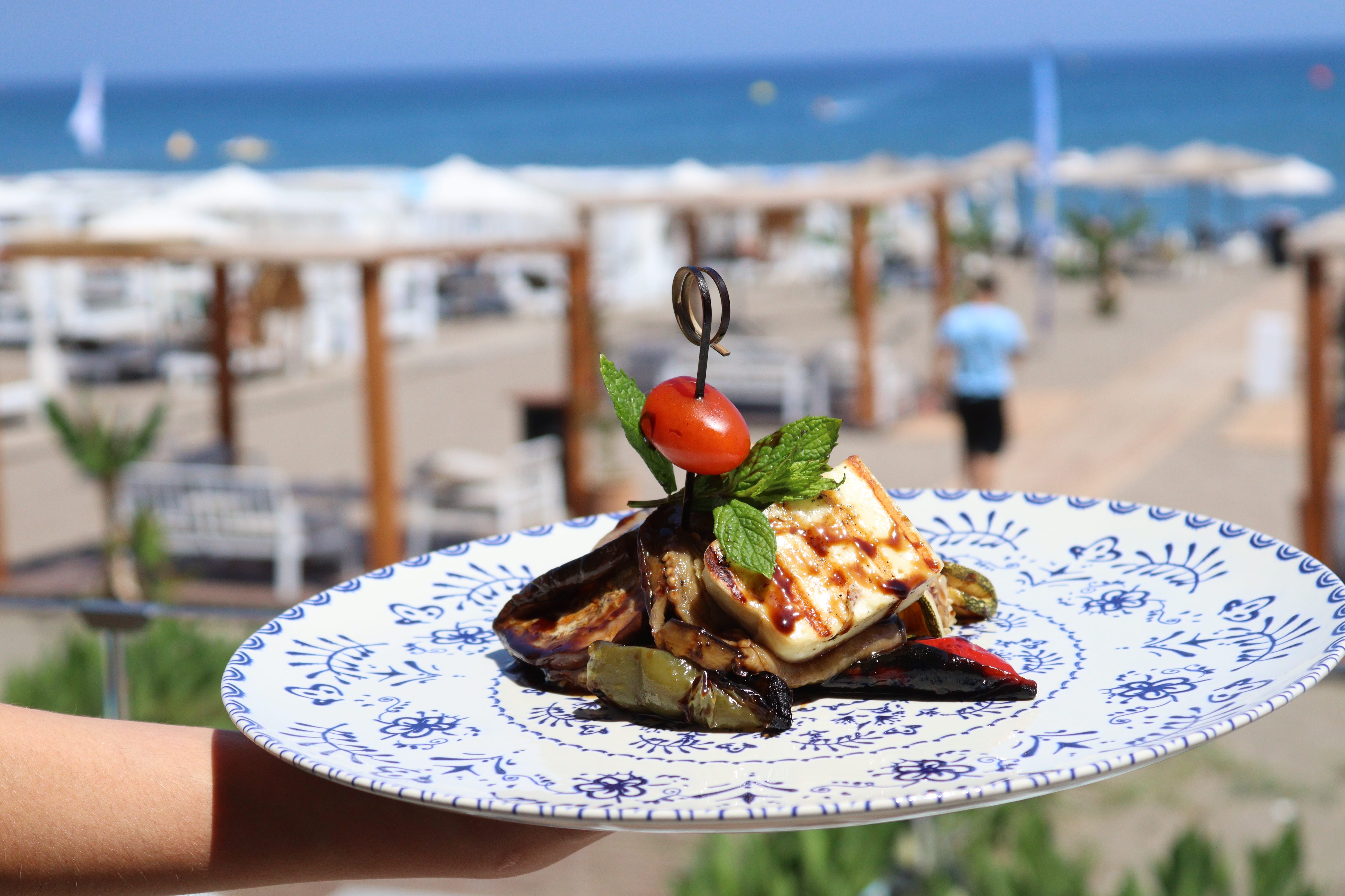 a plate of food on a beach