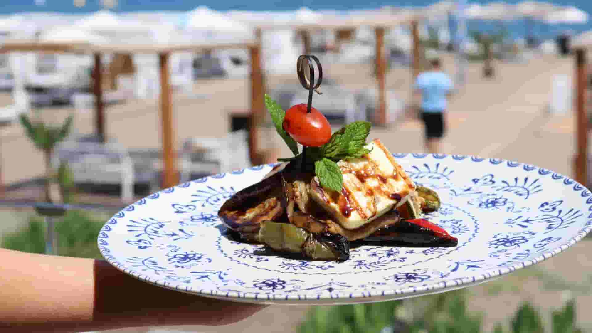 a plate of food on a beach